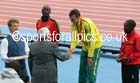 Jimmy Alder presents Michael Shelley (Australia) with his gold medal after winning the marathon, 2014 Commonwealth Games, Glasgow. Photo: David T. Hewitson/Sports for All Pics
